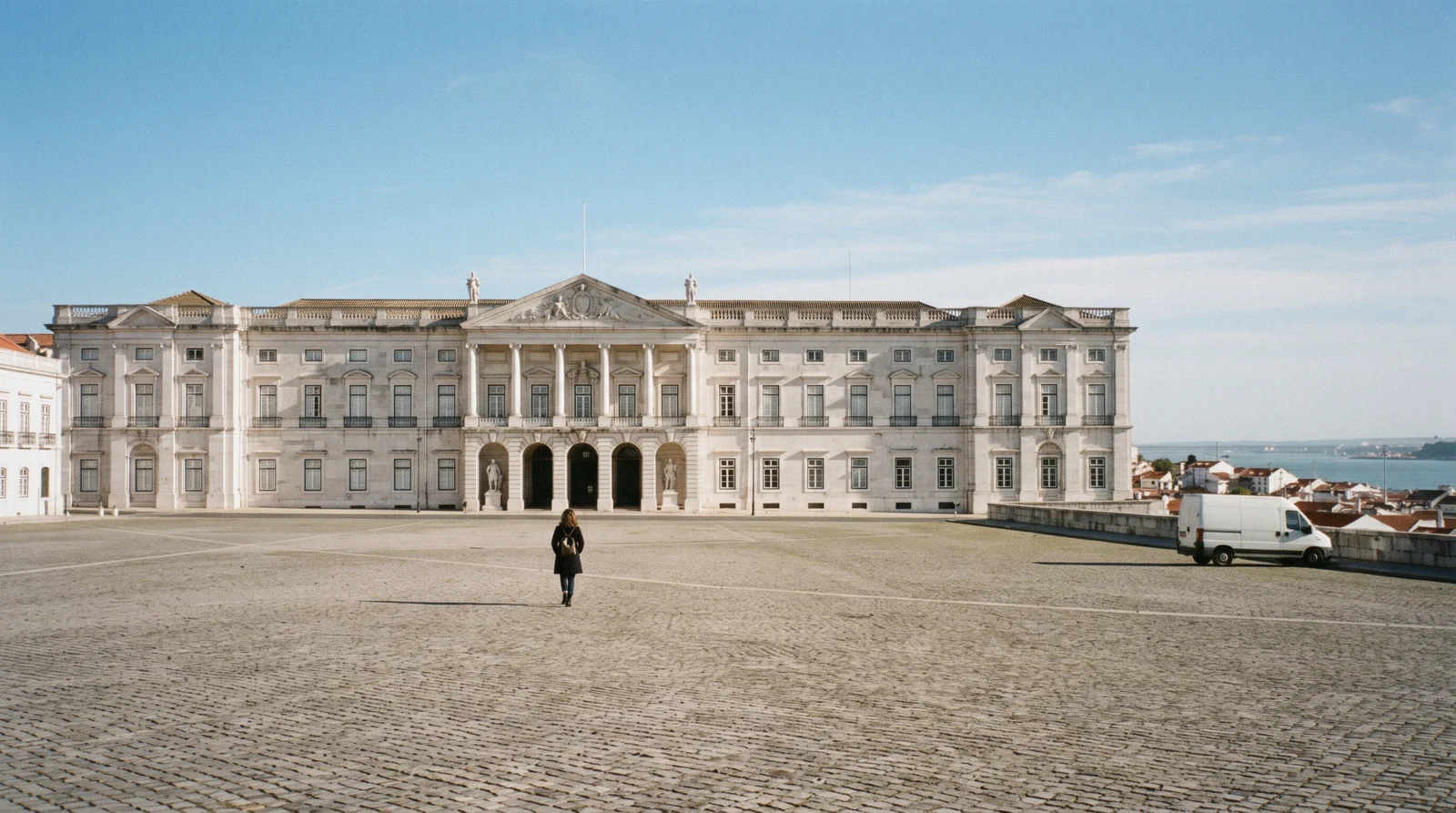 The neoclassical east front of the Ajuda Palace at 10:05 with the Largo da Ajuda empty in front and the Tagus far below, Ajuda Palace Lisbon