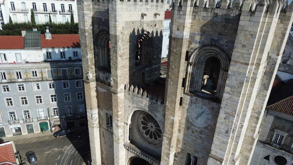 Romanesque towers of Lisbon Cathedral from the tram tracks, seen with a Lisbon Cathedral entry ticket